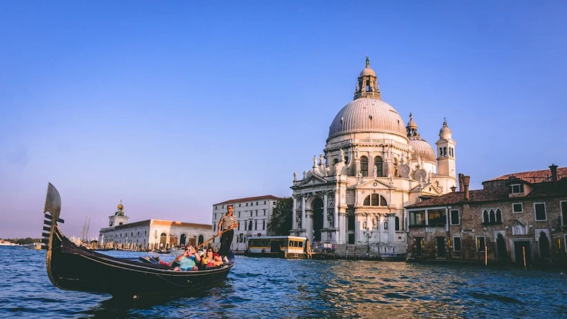 Explore the canals by gondola, Venice, Italy