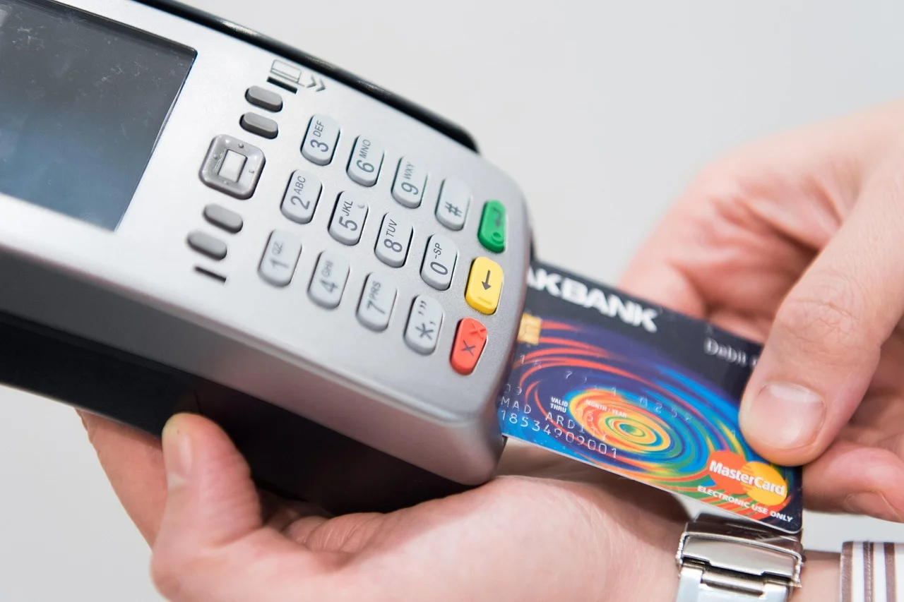 Mastercard inserted into a payment terminal, a gesture that does not work in Iran for foreign cards